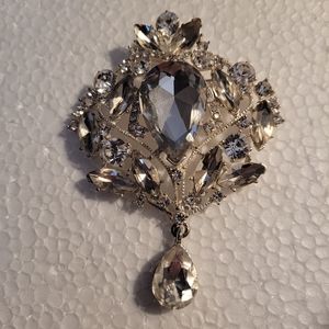 Big crystal brooch with dangling crystal